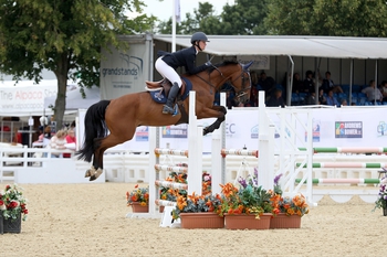 Courtney Young takes the spoils in the Pony Silver League 148cm & Under Final